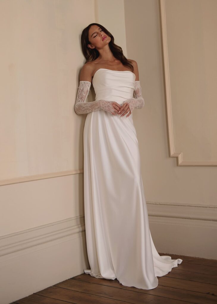 Timeless beauty meets contemporary romance in this minimalist strapless wedding gown.
